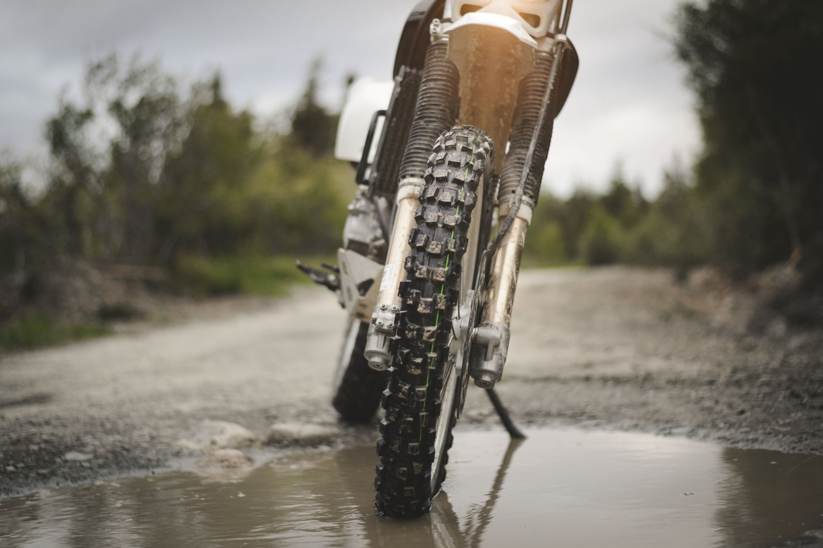 Dirt bike wheel on muddy road