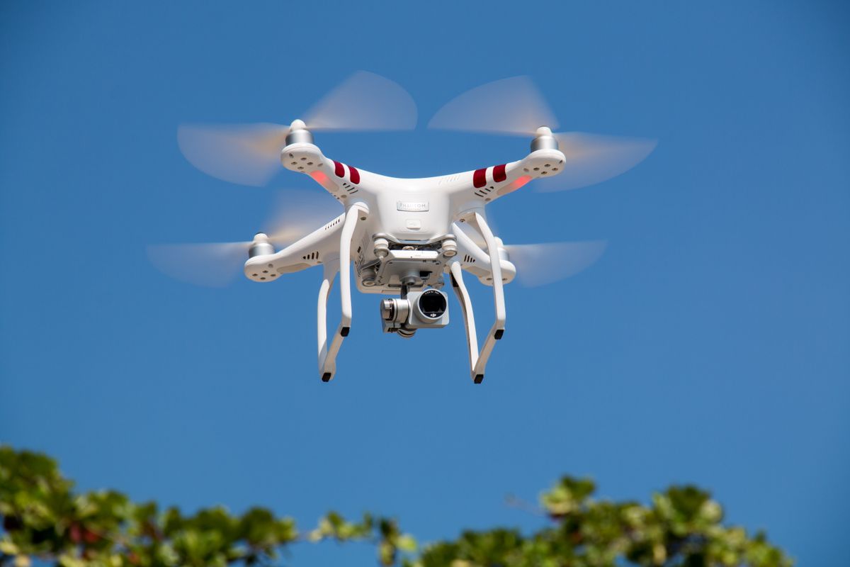 Drone flying over coastal Atlantic Canada landscape for motorcycle touring photography