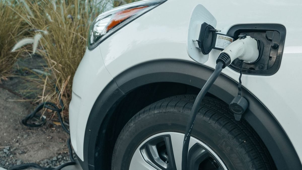 Electric vehicle charging at a station