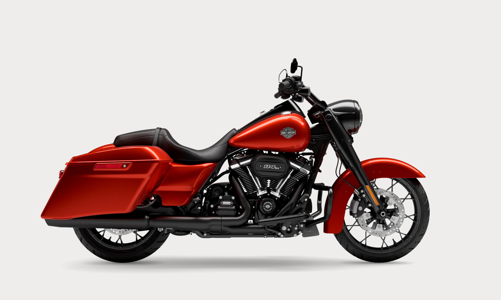 Motorcycle mechanics performing safety inspection and maintenance in a repair shop, representing the 2026 Harley-Davidson recall
