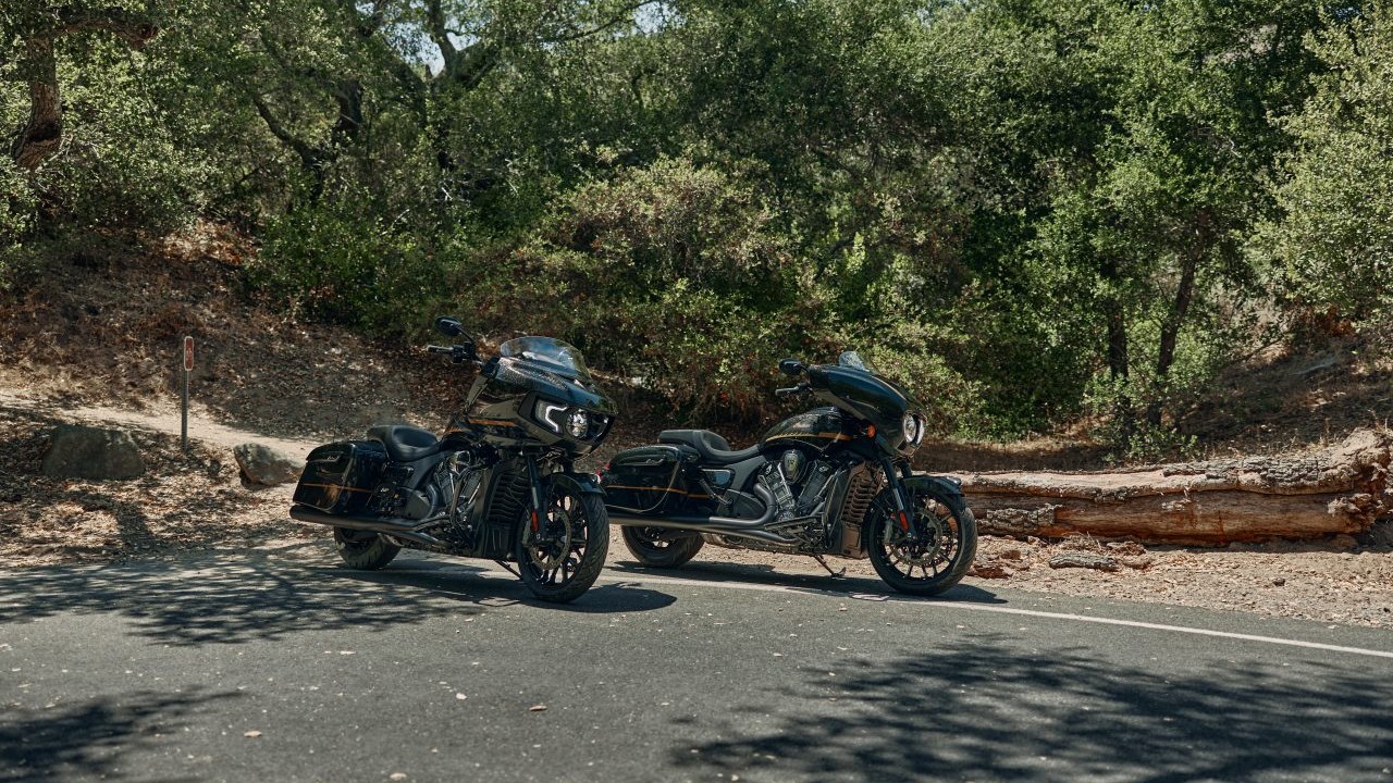 Modern black cruiser motorcycle displayed in a showroom with large glass windows, representing Indian Motorcycle's premium brand positioning under new ownership
