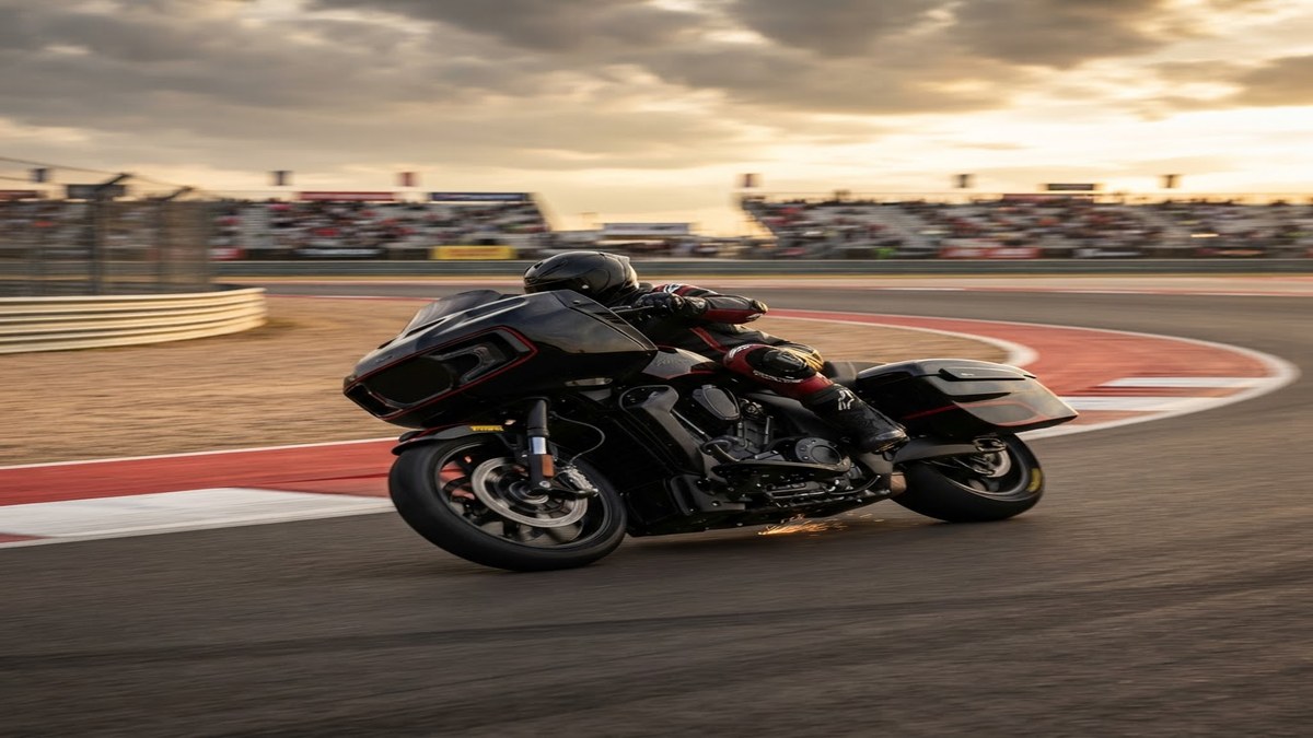 Indian Challenger bagger racing motorcycle leaning into a corner at a circuit during the King of the Baggers championship weekend