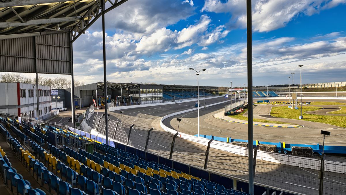 Two motorcycle racers battling through a curve on a road racing track, representing the King of the Baggers Mid-Ohio 2026 round