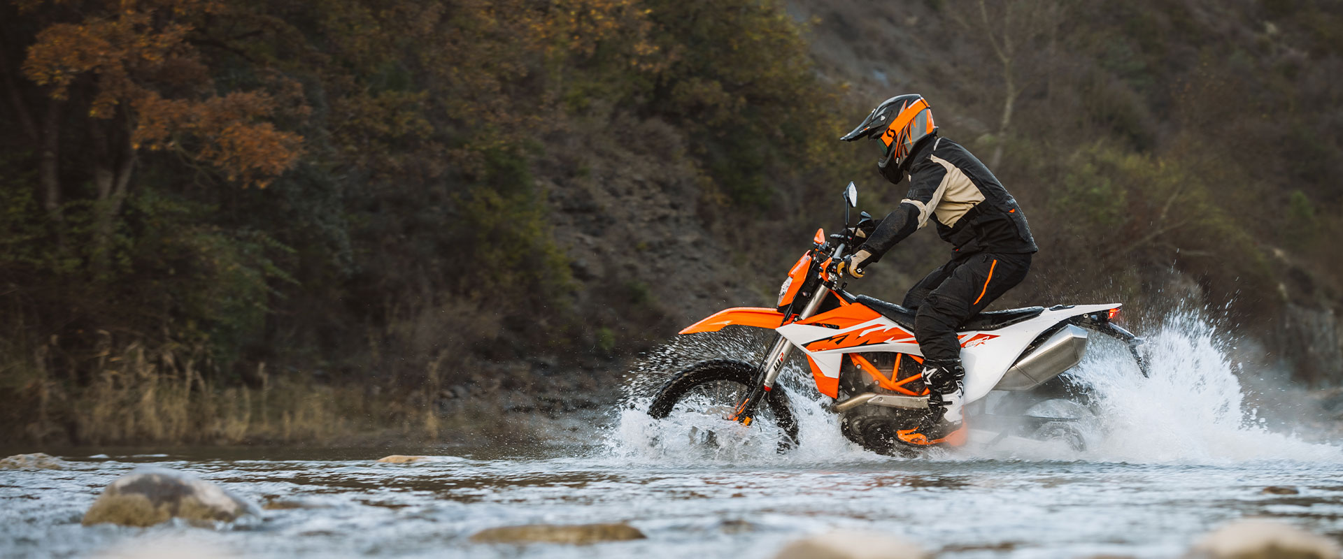 2026 KTM 690 Enduro R dual-sport motorcycle in KTM orange and black showing the LED headlight and TFT display