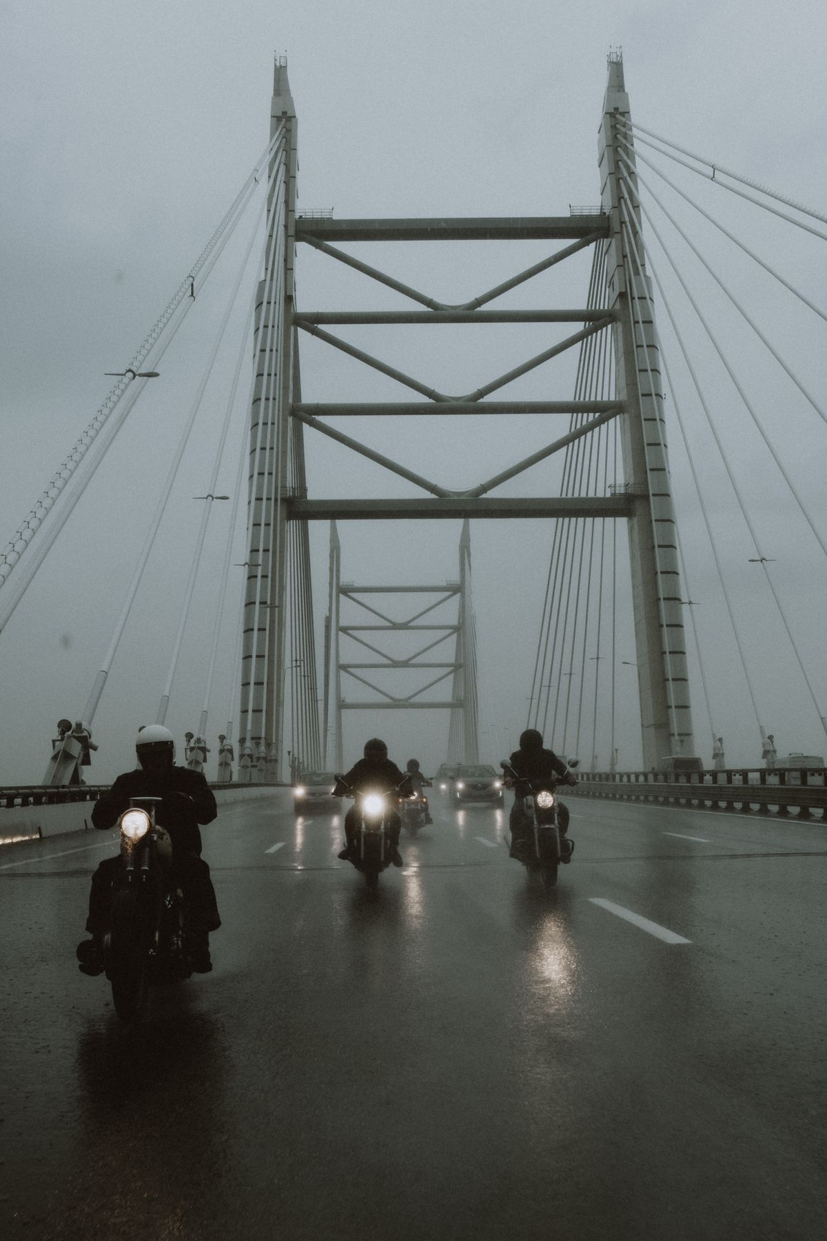 Motorcyclist paused on a scenic road contemplating the ride ahead
