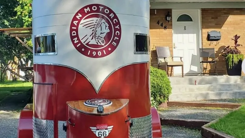 The custom Indian Motorcycle trailer with checkered racing flag flying
