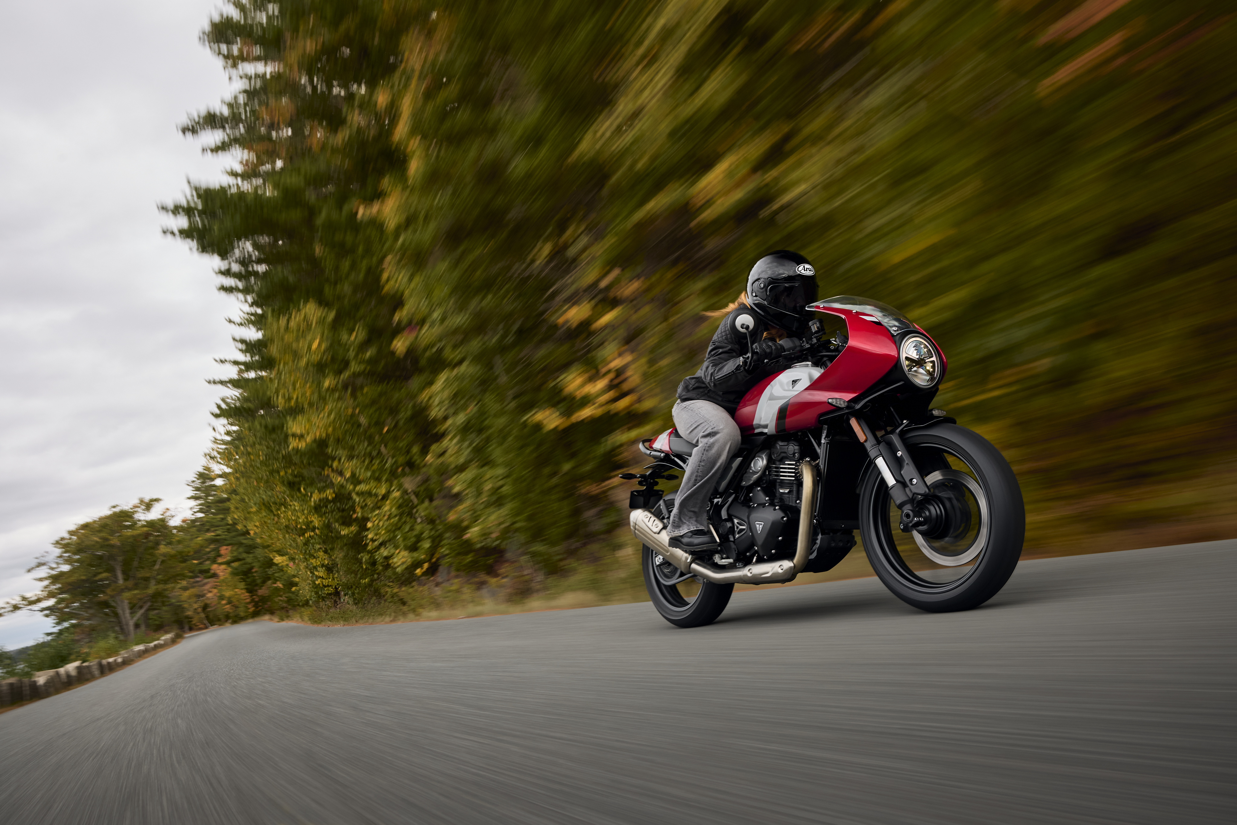 2026 Triumph Thruxton 400 cafe racer motorcycle in Lava Red with clip-on handlebars and seat cowl