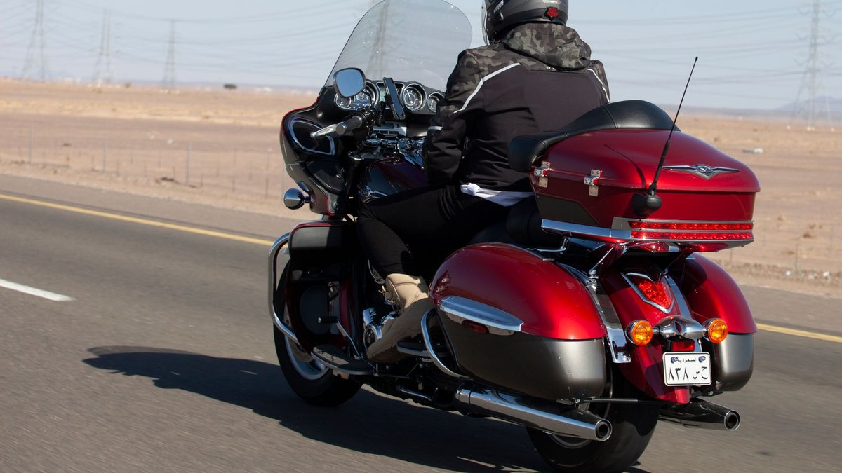 Motorcycle touring windshield at correct height for rider comfort