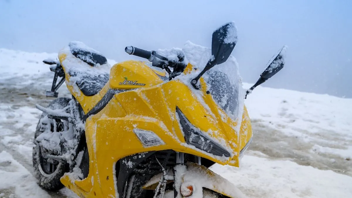 Motorcycle covered in snow on a winter day