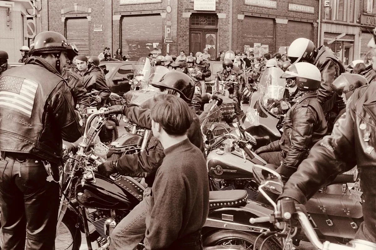 Motorcycle riders in leather gear gathered together — group riding demands reliable communication