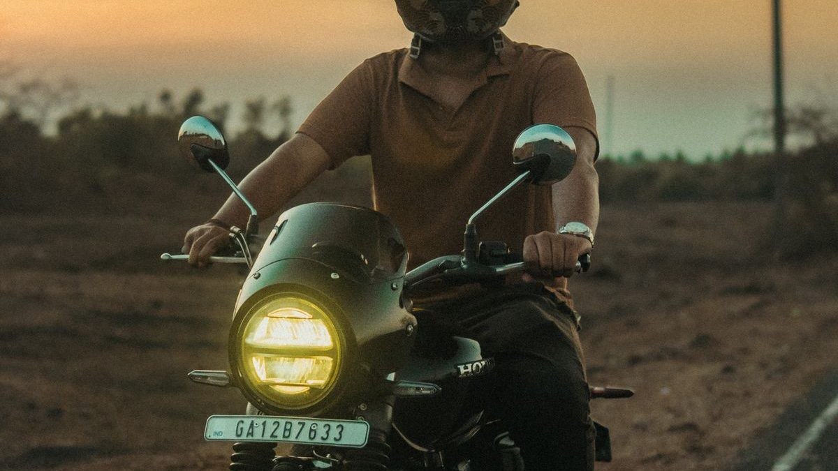 Motorcycle riding at dusk