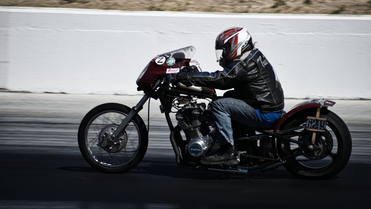 Motorcycle racing at speed on a track