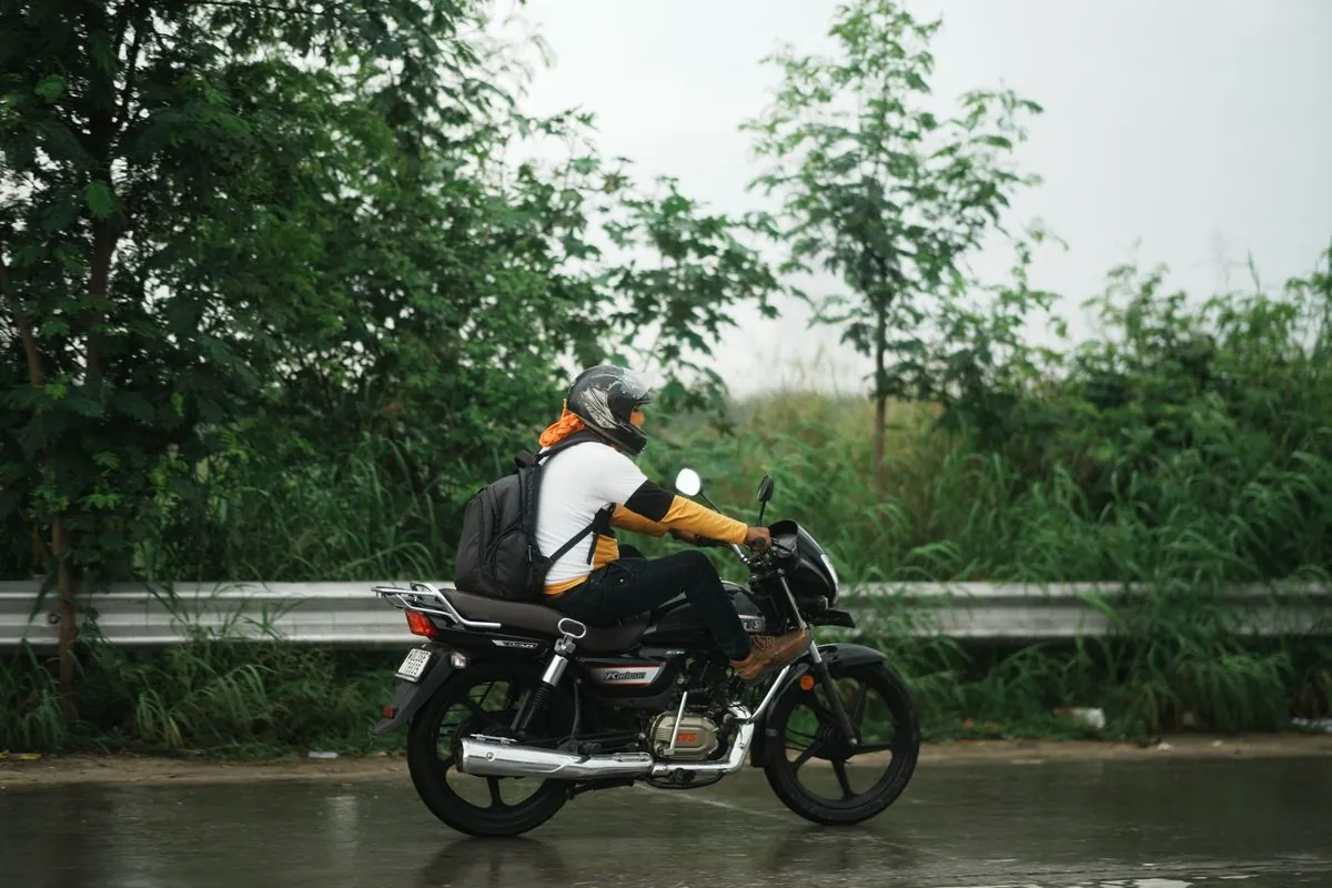 Motorcycle rider in rain gear — wet gear is a daily reality for touring riders