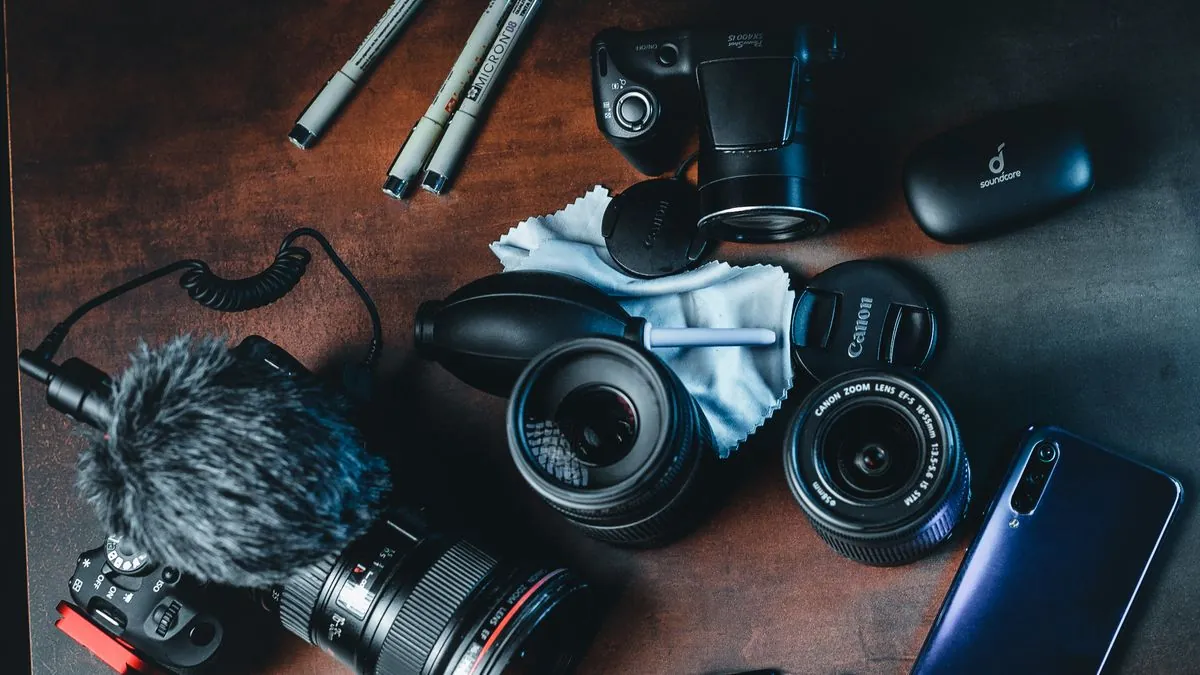 Solo content creator camera setup with Insta360 X5 and GoPro on a desk