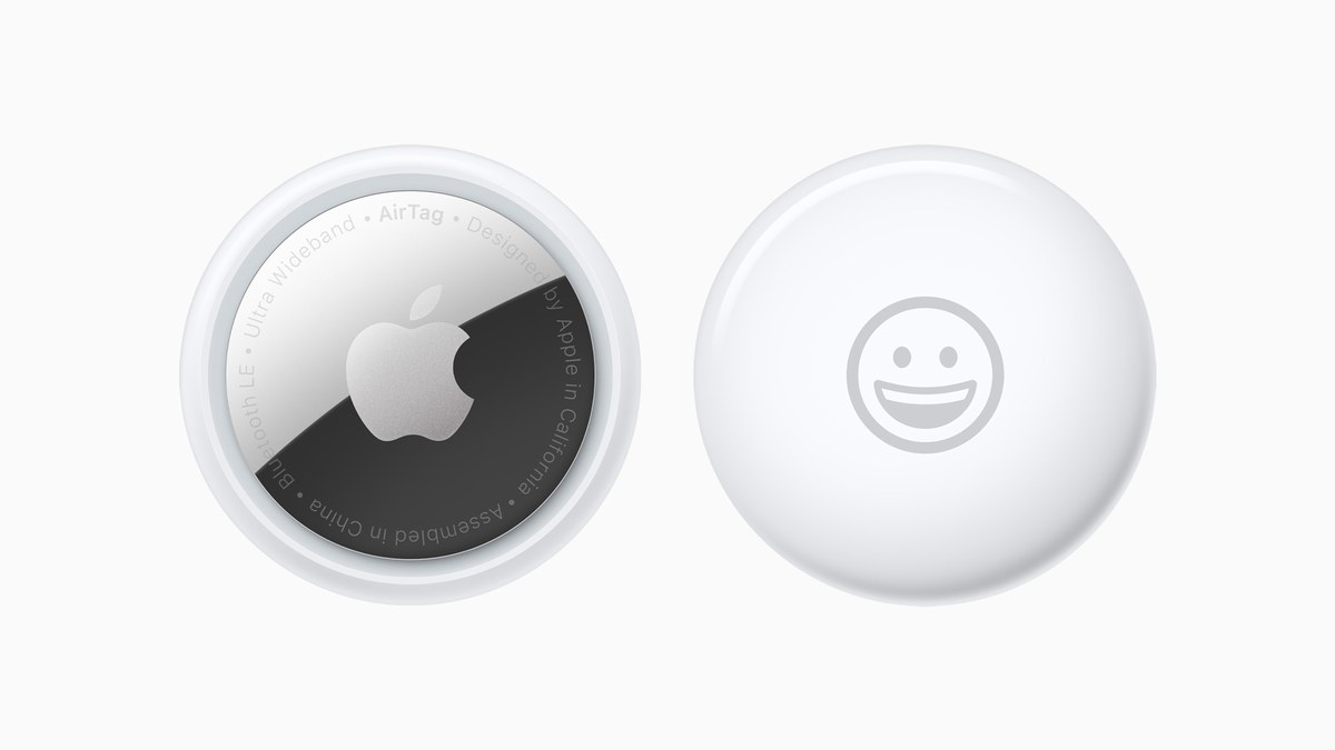 Apple AirTag tracking accessory next to its packaging