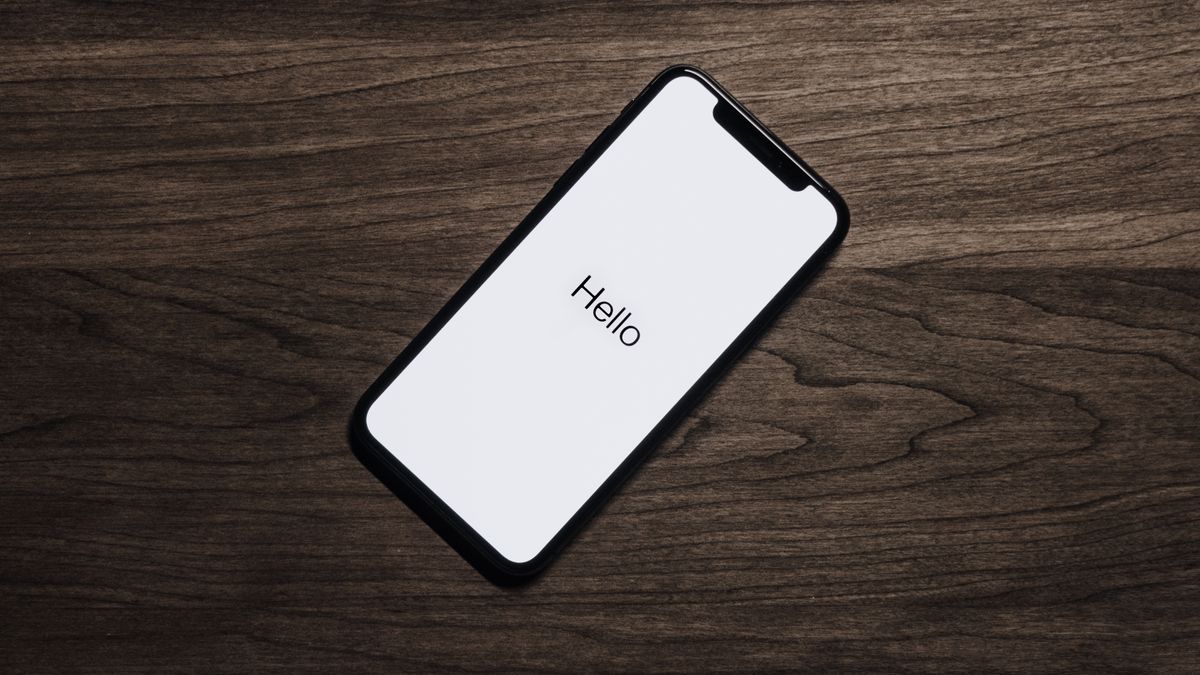 Modern smartphone with triple camera system photographed on a dark surface, representing the upcoming iPhone 18 Pro design