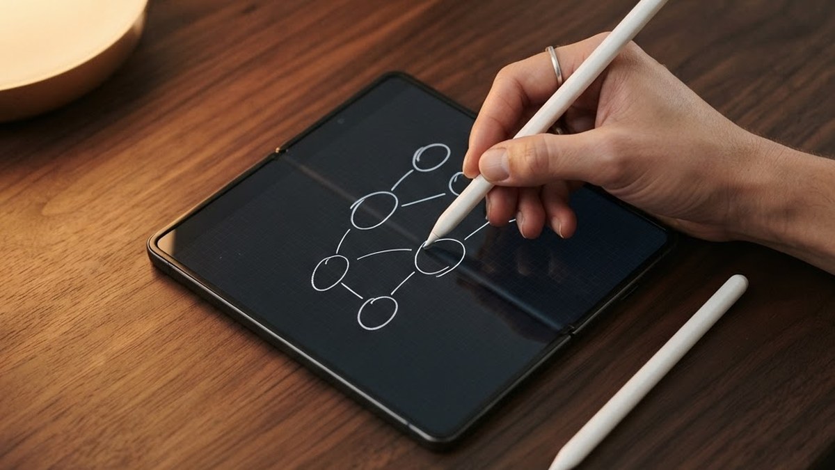 Folded phone with a stylus and a hand sketching, AI illustration