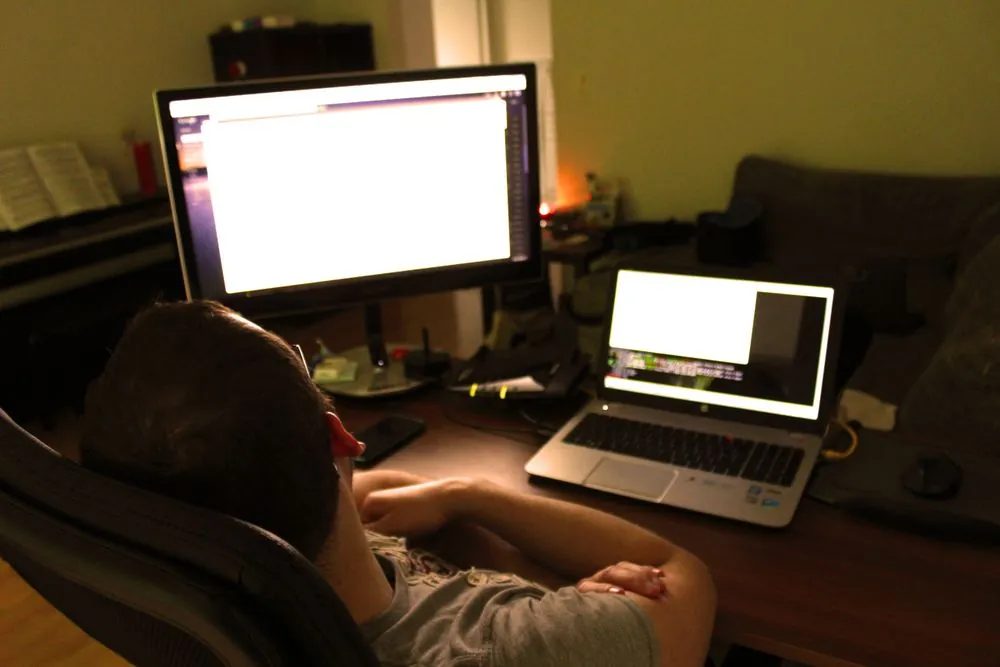 Multi-monitor remote work desk setup with laptop and extended displays